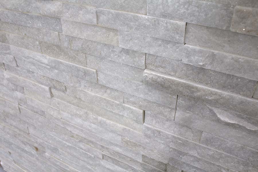 White quartzine split face natural stone wall tiles on display at UK Tiles Direct in Wareham Dorset