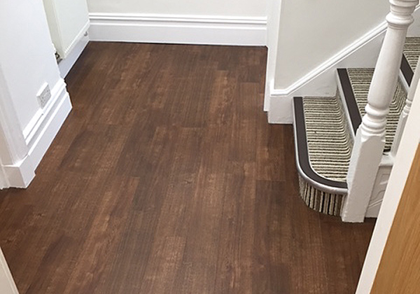 New dark wood Karndean vinyl floor tiles installed by UK Tiles for Denistry @ 68 of Poole