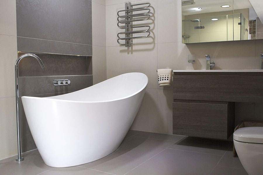 Designer pattern thin porcelain tiles adorn this luxury bathroom display at UK Tiles Direct in Wareham