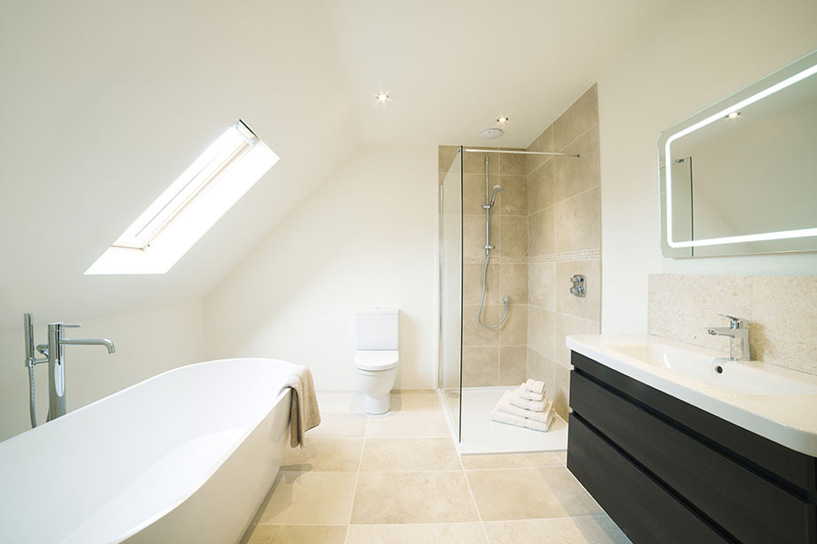 Luxury bathroom with large porcelain tiles and glass walkin shower