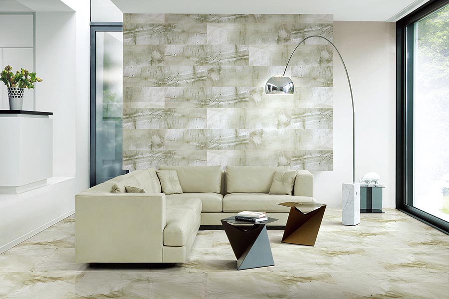A lounge feature wall created using natural sandstone effect porcelain tiles