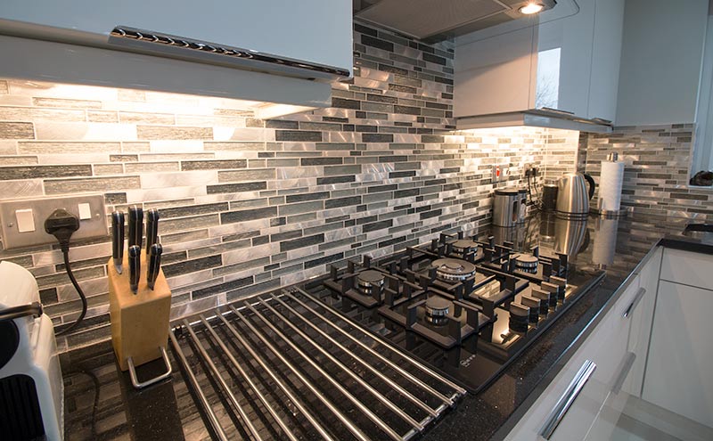 Grey mosaic kitchen splashback