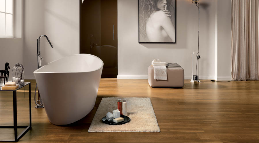 Luxury bathroom featuring rich cherry toned hardwood effect porcelain floor tiles